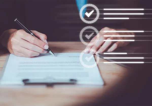 a man in a suit signs a contract with a graphic of a checklist floats on the image