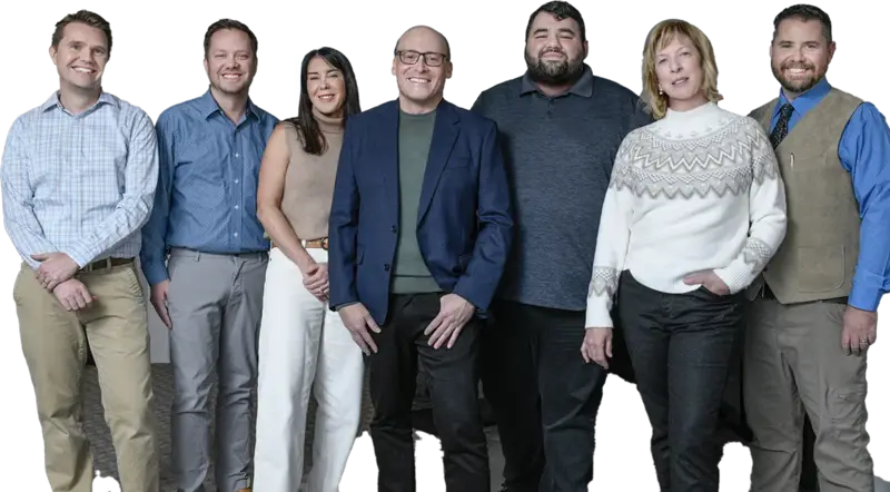 STF Consulting Team, group photo of IT experts standing and smiling at camera